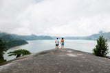 Two people standing on a cliff overlooking a Canadian landscape, promoting Sunii Energy Gum as 100% Canadian made with top quality