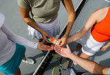 Tennis players sharing Sunii Energy Gum on court for an energy boost during a match break